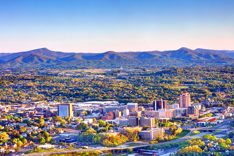 A far off view of the downtown region of Roanoke, VA as the sun rises on a springtime morning