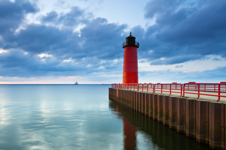 A view of the Milwaukee Pierhead Light lighthouse during a partly cloudy afternoon