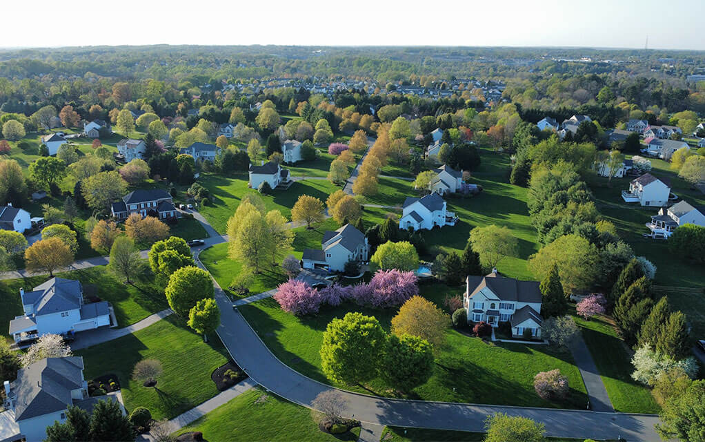 Aerial view of a middle class suburban neighborhood on a clear and sunny spring day