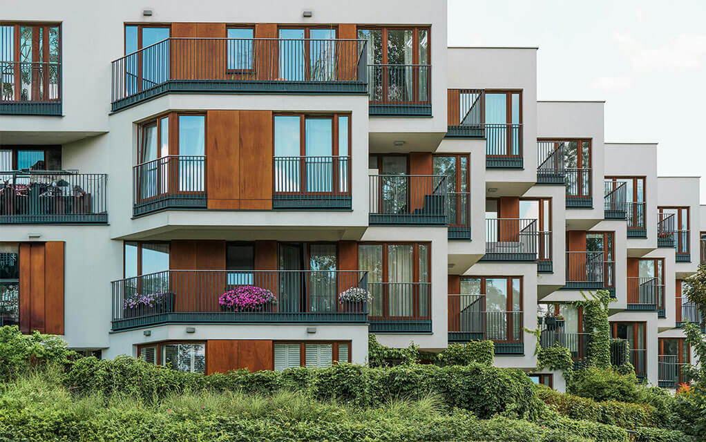Exterior view of a modern apartment complex on a cloudy but still bright day
