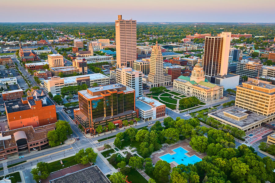 An areal view of Fort Wayne, IN and its downtown area at sunset on a clear day